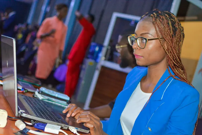 Engineer building a web application on a laptop during a working session